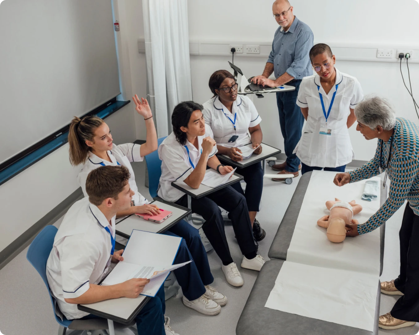 Instructor demonstrating CPR on dummy